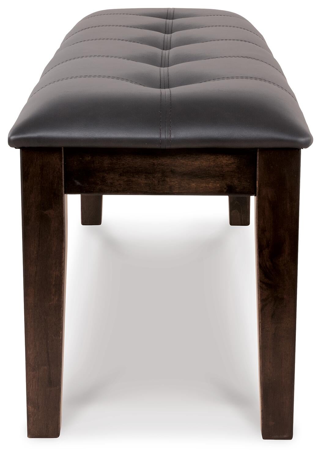 The Haddigan Large UPH Dining Room Bench features a black tufted cushion and dark wooden legs, providing stylish front-facing bench seating for any dining area.