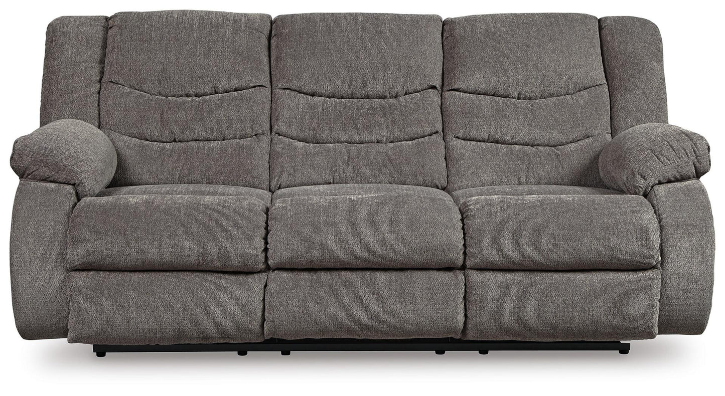 The Tulen Reclining Sofa is a gray, three-seater with dual-sided recliners, plush cushions, and armrests, upholstered in soft chenille fabric, shown from the front against a white background.