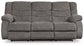 The Tulen Reclining Sofa is a gray, three-seater with dual-sided recliners, plush cushions, and armrests, upholstered in soft chenille fabric, shown from the front against a white background.
