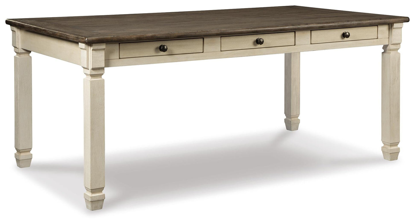 The Bolanburg Rectangular Dining Room Table features a dark brown top, white legs, and three drawers with round handles, offering stylish two-tone design and convenient storage for your space.