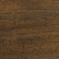Close-up of the Moriville RECT DRM Counter EXT Table’s wooden surface, showcasing its dark brown finish, visible grain patterns, and small vertical marks.