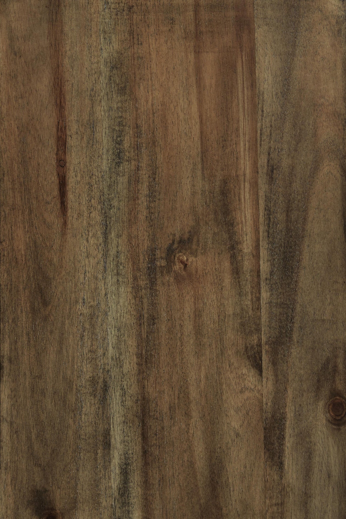 A close-up of the Moriville Dining Room Server’s wooden surface shows its distressed nutmeg finish, visible grain patterns, and subtle color variations—adding character to any dining space.
