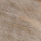 Close-up of the Fossil Ridge Storage Bench’s light brown wooden surface, highlighting its visible grain and hand-carved craftsmanship.