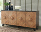 The Robin Ridge Accent Cabinet showcases a bold geometric pattern and a dark top, with space for books, candles, and vases—an ideal accent piece to elevate any stylish living area.