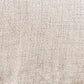 Close-up of the Tartonelle Accent Chair’s beige linen upholstery, highlighting its subtle woven pattern.