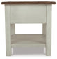 Front view of Bolanburg Rectangular End Table with a two-tone distressed finish, dark brown top, light-colored body, lower storage shelf, and a smooth-gliding drawer.