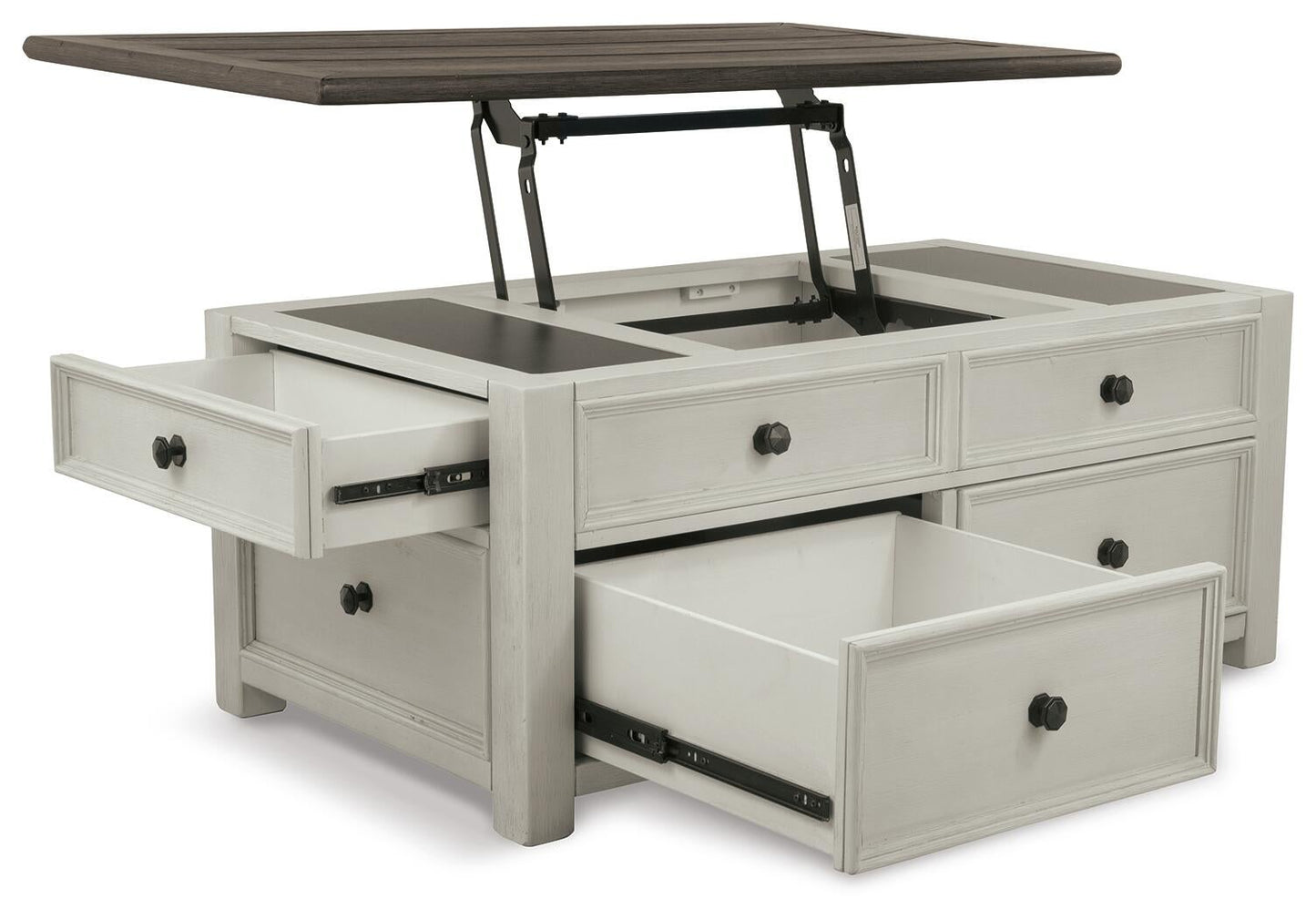 The Bolanburg Lift Top Cocktail Table features an antique white finish, a dark wood top with metal hinges that lifts to reveal extra compartments, and multiple open storage drawers.