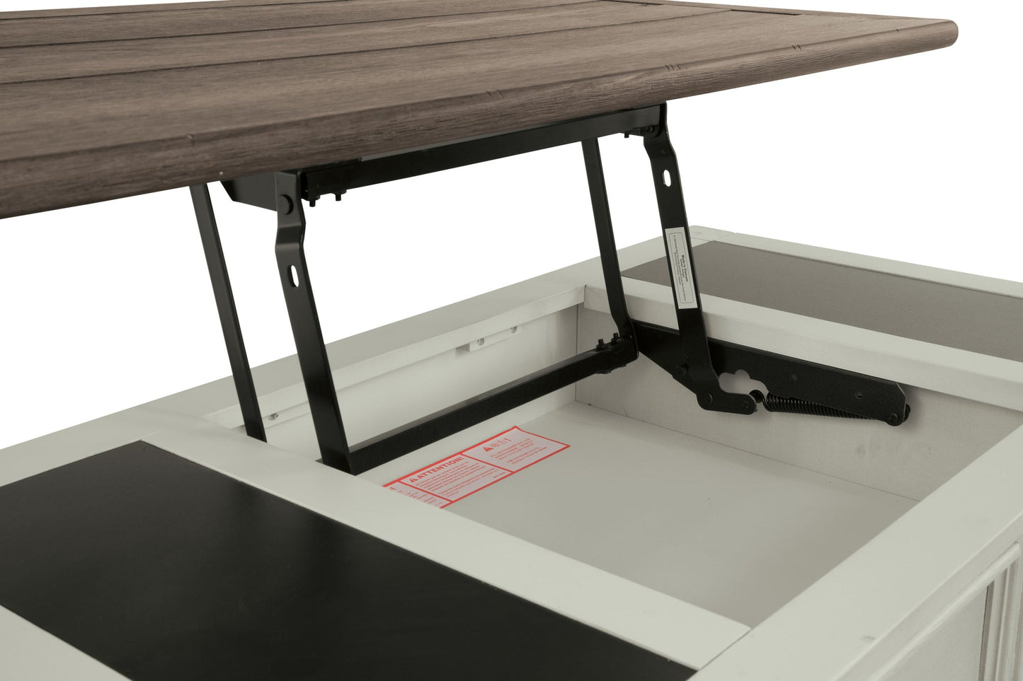 A close-up of the Bolanburg Lift Top Cocktail Table, showcasing its antique white finish, metal hinges, and an internal storage compartment beneath the raised wooden tabletop.