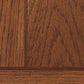 Close-up of the Breegin Chair Side End Table's wooden surface with a natural grain pattern and medium brown finish—smooth, well-crafted, and perfect for adding Mission-style elegance to any living space.