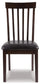 The Hammis Dining UPH Side Chair (2/CN) features a contemporary dark wood finish, rake back slats, and a cushioned black seat, shown from the front on a white background.