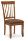 The Berringer Dining UPH Side Chair (2/CN) features a wooden spindle back and a cushioned brown microfiber seat, displayed against a white background.