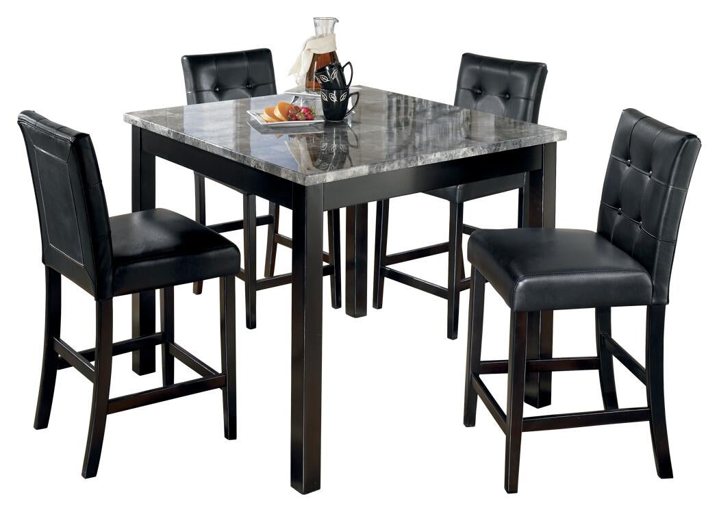 The Maysville Square Counter Table Set (5/CN) features a faux marble counter height table with four black cushioned bar stools, topped with a carafe, cups, and a fruit plate.