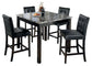 The Maysville Square Counter Table Set (5/CN) features a faux marble counter height table with four black cushioned bar stools, topped with a carafe, cups, and a fruit plate.