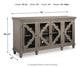 The Fossil Ridge Accent Cabinet features 4 wooden doors with glass inlays, adjustable interior shelves, and decorative trim. Dimensions: 39.25"H x 76"W x 18"D. Weight: 191.36 lbs.