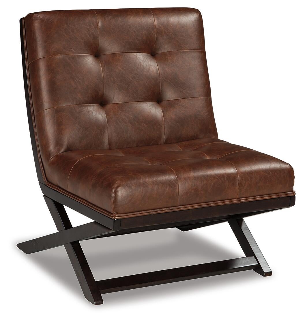 The Sidewinder Accent Chair is a modern armless accent seat inspired by the iconic Barcelona chair, with brown tufted faux leather upholstery and an angular dark wood base.