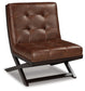 The Sidewinder Accent Chair is a modern armless accent seat inspired by the iconic Barcelona chair, with brown tufted faux leather upholstery and an angular dark wood base.