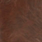 Close-up of brown faux leather with natural grain and subtle creases, perfect for the Sidewinder Accent Chair.