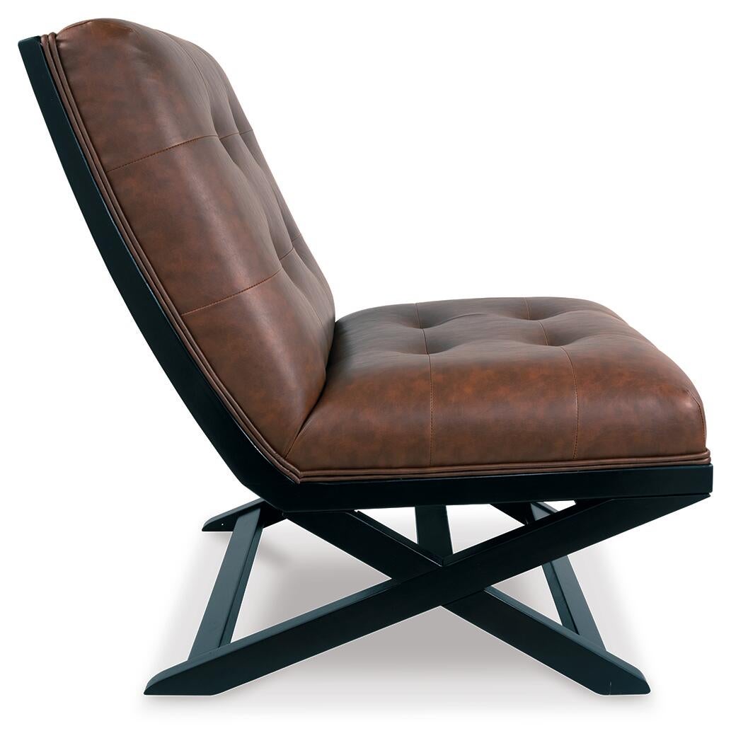 Side view of the Sidewinder Accent Chair, inspired by the Barcelona chair, with brown tufted faux leather and a black metal X-shaped base, set against a white background.