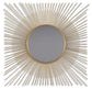 The Elspeth Accent Mirror features a round shape and a sunburst design with radiating goldtone metal rods of varying lengths for a striking, elegant look.