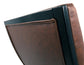 Close-up view of the Sidewinder Accent Chair’s backrest, featuring brown faux leather upholstery and a black frame, isolated on a white background.