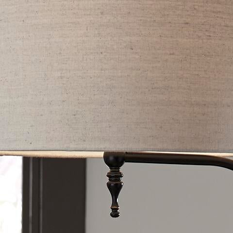 Close-up of the Anemoon Metal Floor Lamp (1/CN), featuring a beige fabric lampshade with a decorative dark metal finial and an elegant metal base, set against a neutral background.