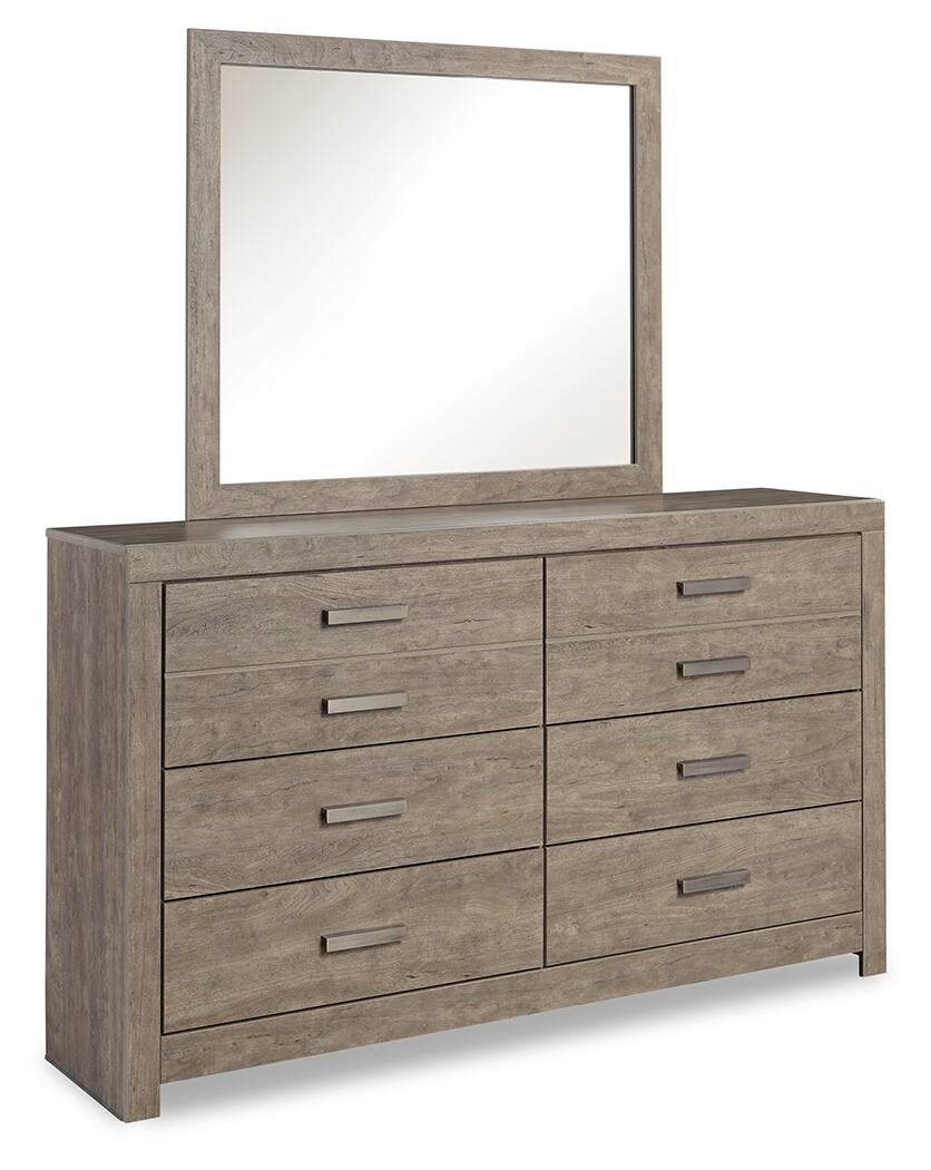 The Culverbach Dresser and Mirror features a weathered driftwood finish, eight drawers with rectangular handles, and a large matching rectangular mirror in a wooden frame.