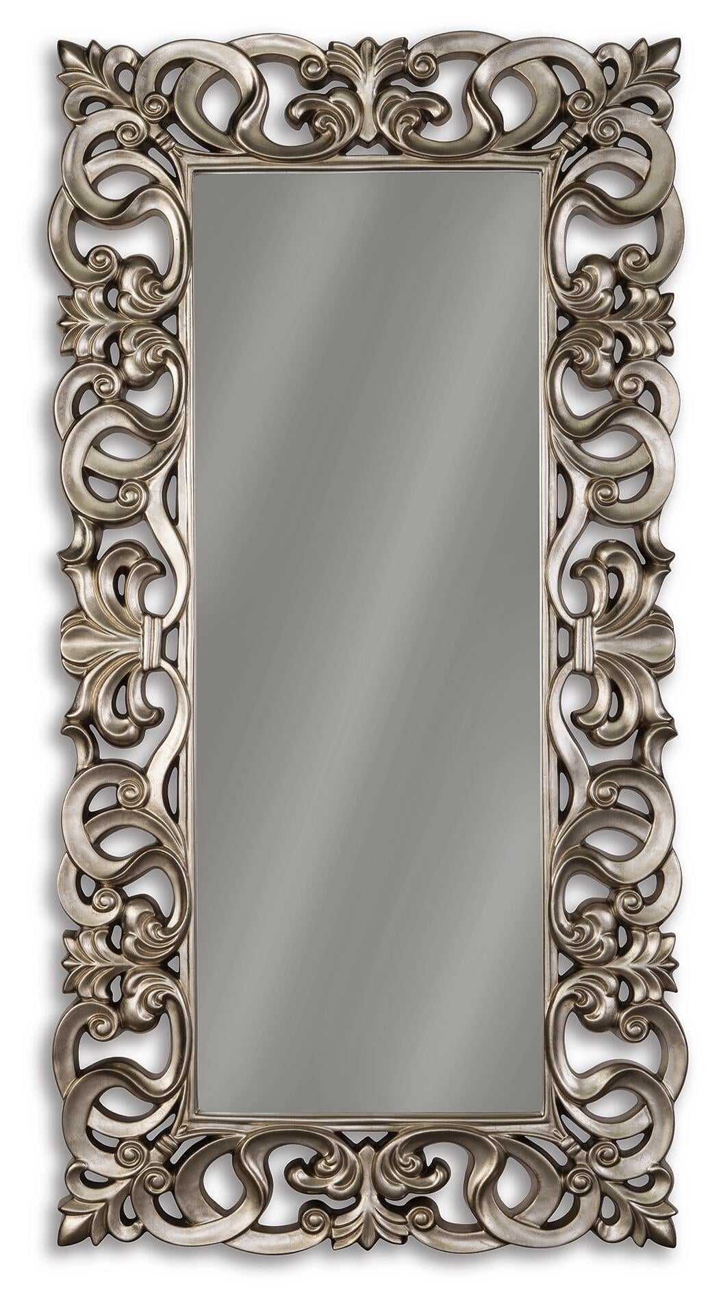 The Lucia Floor Mirror features a rectangular shape and an antique silver frame with ornate scrollwork, including swirling and curved decorative patterns.