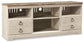 The Willowton LG TV Stand w/Fireplace Option features a distressed wooden finish, two central shelves, four drawers, and convenient cable management slots on the back panel.