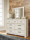 Bellaby Queen Crossbuck Panel Bed with Mirrored Dresser at Walker Mattress and Furniture Locations in Cedar Park and Belton TX.
