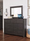Brinxton King/California King Panel Headboard with Mirrored Dresser, Chest and Nightstand at Walker Mattress and Furniture Locations in Cedar Park and Belton TX.