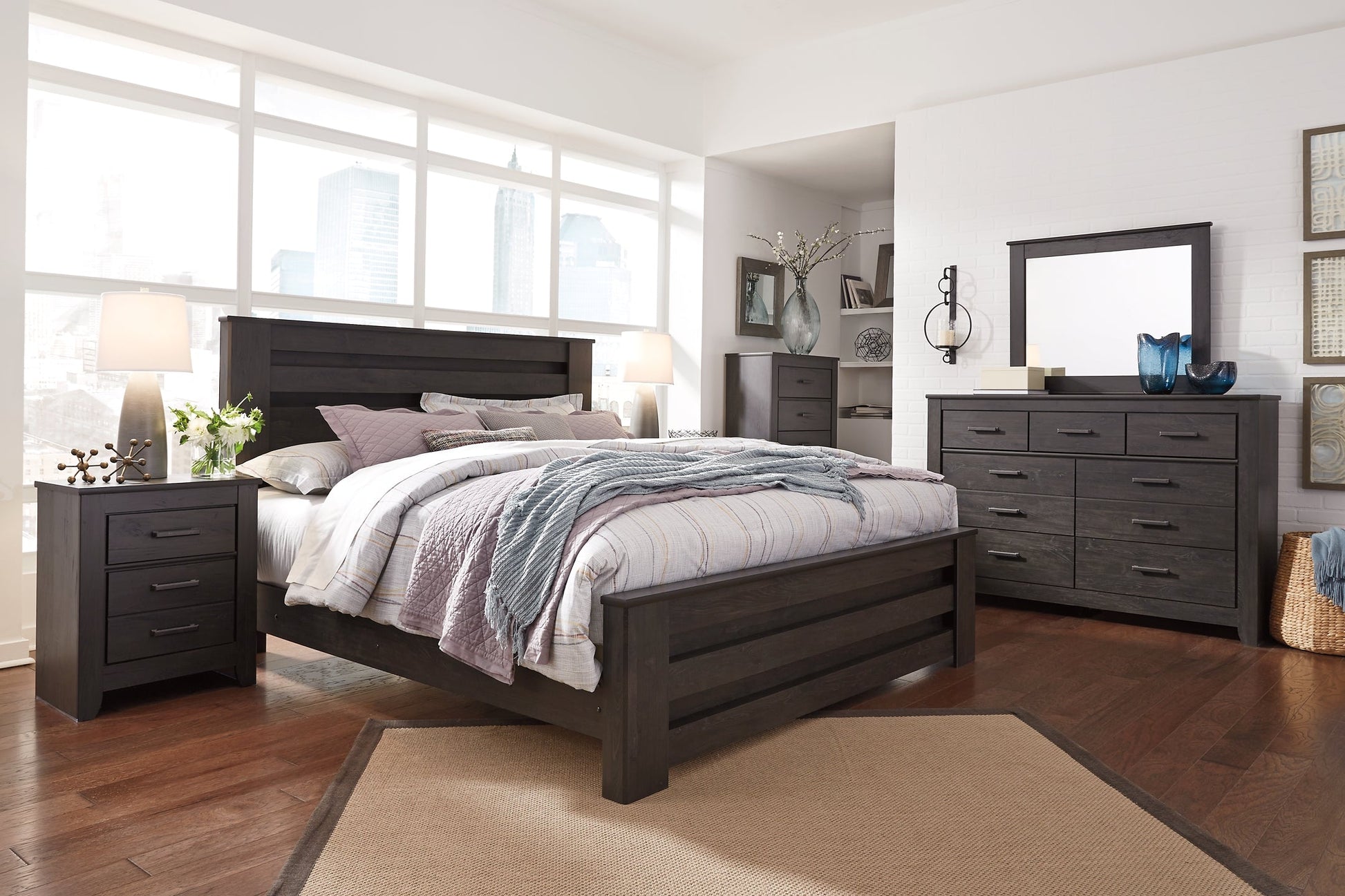 Brinxton King Panel Bed with Mirrored Dresser, Chest and Nightstand at Walker Mattress and Furniture Locations in Cedar Park and Belton TX.