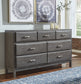 Caitbrook Queen Storage Bed with 8 Drawers with Dresser and Chest at Walker Mattress and Furniture Locations in Cedar Park and Belton TX.