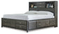 Caitbrook Queen Storage Bed with 8 Storage Drawers with Mirrored Dresser and 2 Nightstands at Walker Mattress and Furniture Locations in Cedar Park and Belton TX.