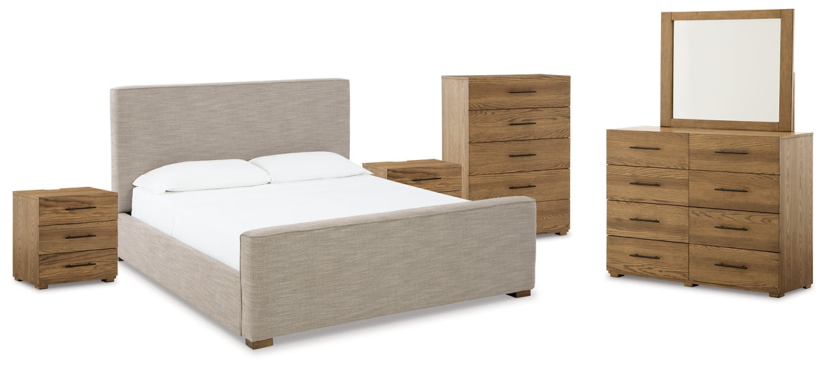 Dakmore California King Upholstered Bed with Mirrored Dresser, Chest and 2 Nightstands at Walker Mattress and Furniture Locations in Cedar Park and Belton TX.