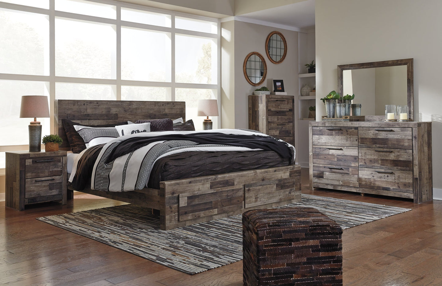 Derekson King Panel Bed with 2 Storage Drawers with Mirrored Dresser, Chest and 2 Nightstands at Walker Mattress and Furniture Locations in Cedar Park and Belton TX.