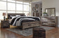 Derekson King Panel Bed with Mirrored Dresser, Chest and Nightstand at Walker Mattress and Furniture Locations in Cedar Park and Belton TX.