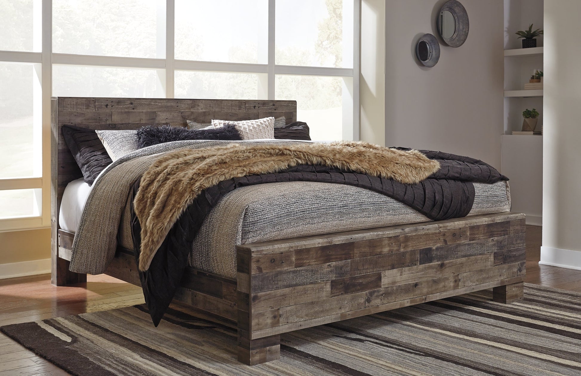Derekson King Panel Bed with Mirrored Dresser, Chest and Nightstand at Walker Mattress and Furniture Locations in Cedar Park and Belton TX.