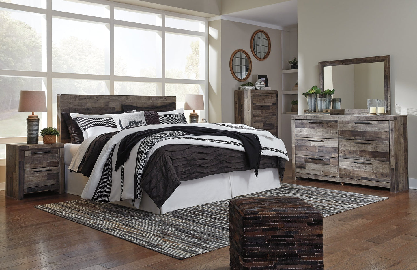 Derekson King Panel Headboard with Mirrored Dresser, Chest and 2 Nightstands at Walker Mattress and Furniture Locations in Cedar Park and Belton TX.