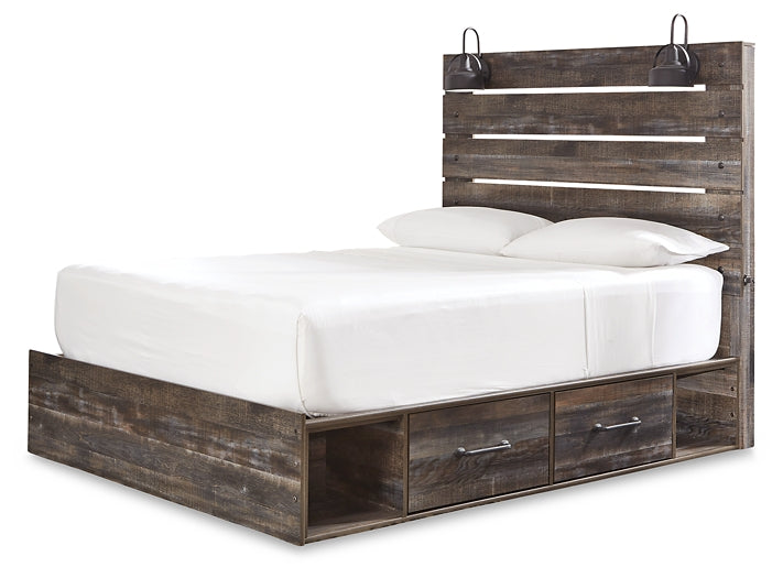 Drystan King Panel Bed with Mirrored Dresser, Chest and 2 Nightstands at Walker Mattress and Furniture Locations in Cedar Park and Belton TX.