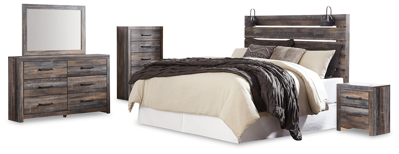 Drystan King Panel Headboard with Mirrored Dresser, Chest and Nightstand at Walker Mattress and Furniture Locations in Cedar Park and Belton TX.