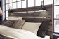 Drystan Queen Panel Bed with 2 Storage Drawers with Mirrored Dresser, Chest and Nightstand at Walker Mattress and Furniture Locations in Cedar Park and Belton TX.