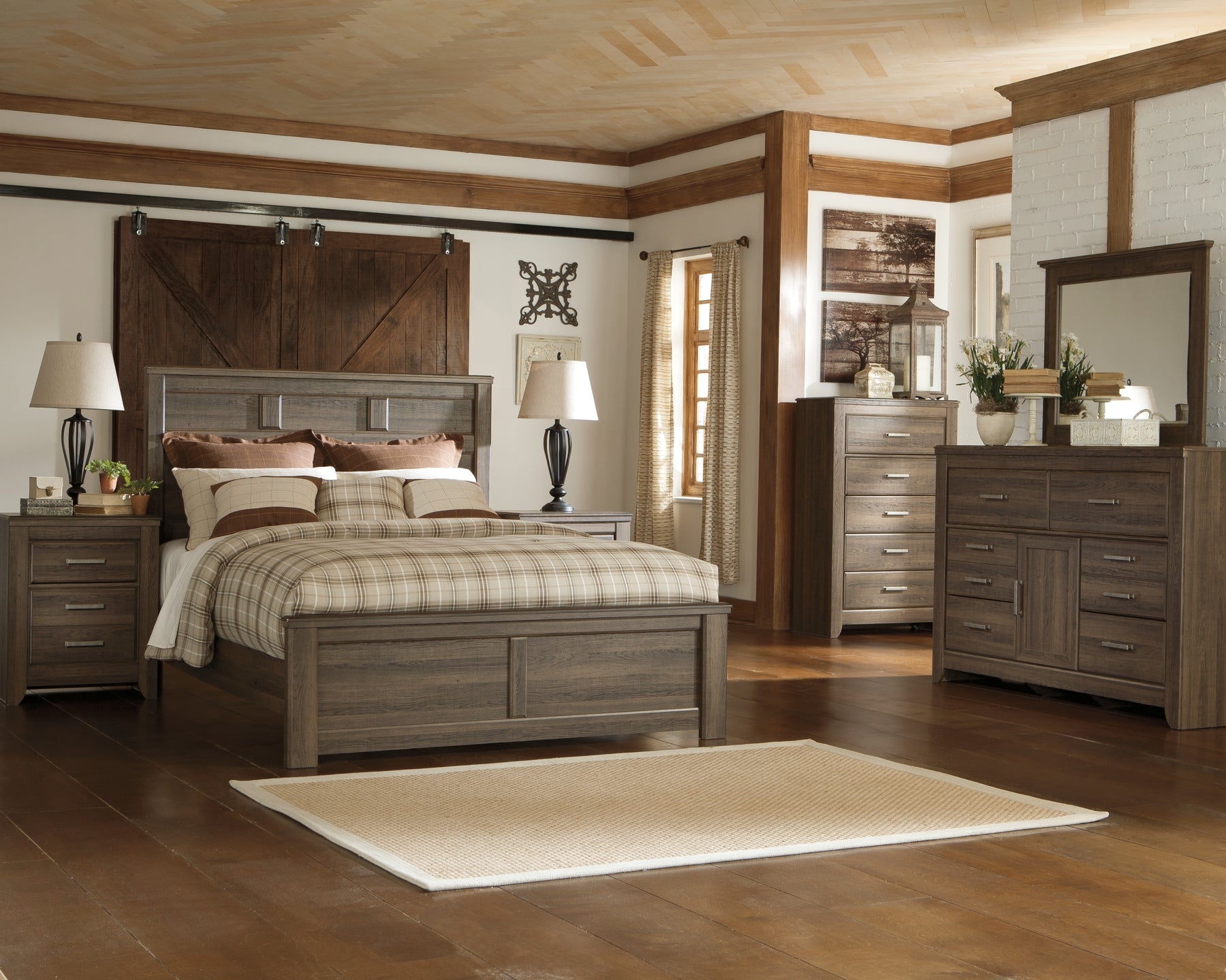 Juararo Queen Panel Bed with Mirrored Dresser, Chest and Nightstand at Walker Mattress and Furniture Locations in Cedar Park and Belton TX.