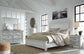 Kanwyn King Panel Bed with Mirrored Dresser at Walker Mattress and Furniture Locations in Cedar Park and Belton TX.