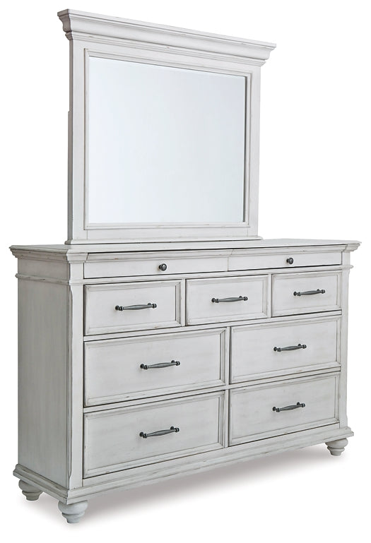 Kanwyn King Panel Bed with Mirrored Dresser at Walker Mattress and Furniture Locations in Cedar Park and Belton TX.
