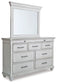 Kanwyn King Panel Bed with Mirrored Dresser at Walker Mattress and Furniture Locations in Cedar Park and Belton TX.