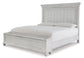 Kanwyn King Panel Bed with Storage with Mirrored Dresser, Chest and Nightstand at Walker Mattress and Furniture Locations in Cedar Park and Belton TX.