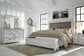 Kanwyn Queen Panel Bed with Storage with Mirrored Dresser and Chest at Walker Mattress and Furniture Locations in Cedar Park and Belton TX.