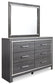 Lodanna Queen Panel Bed with 2 Storage Drawers with Mirrored Dresser and Chest at Walker Mattress and Furniture Locations in Cedar Park and Belton TX.